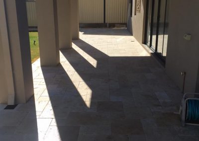 Travertine pavers in outdoor verandah area installed by southcity landscaping